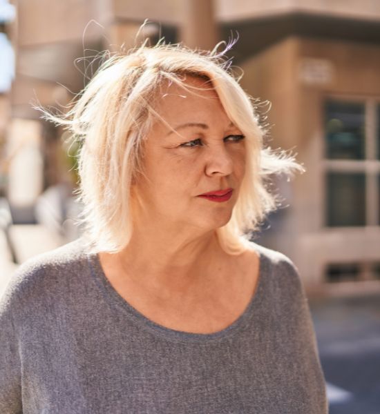 Angela looks off to the side