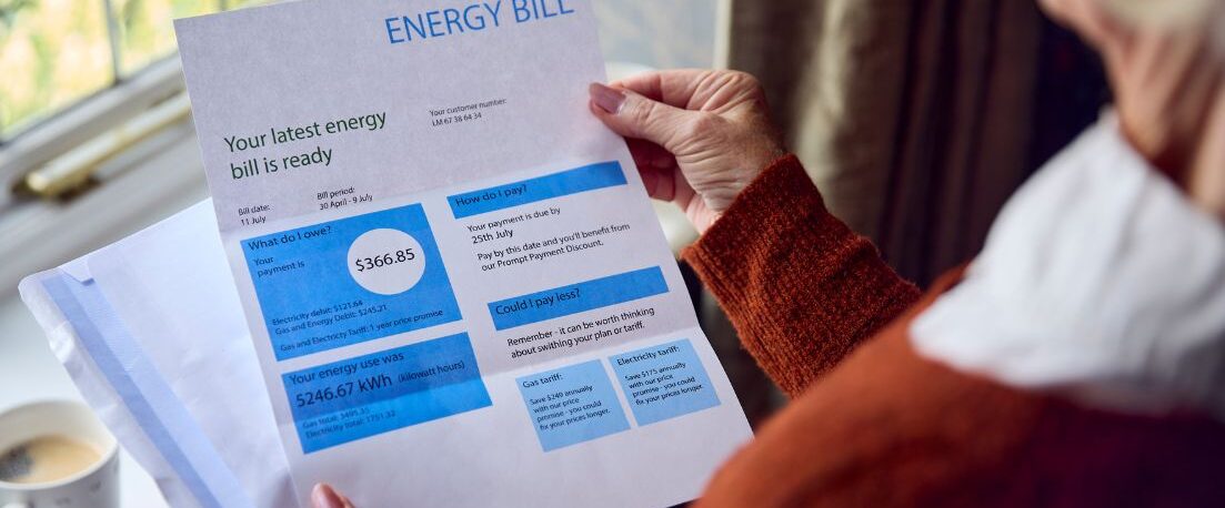 person looking at an energy bill