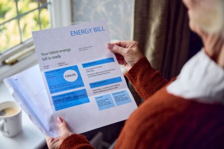 person looking at an energy bill